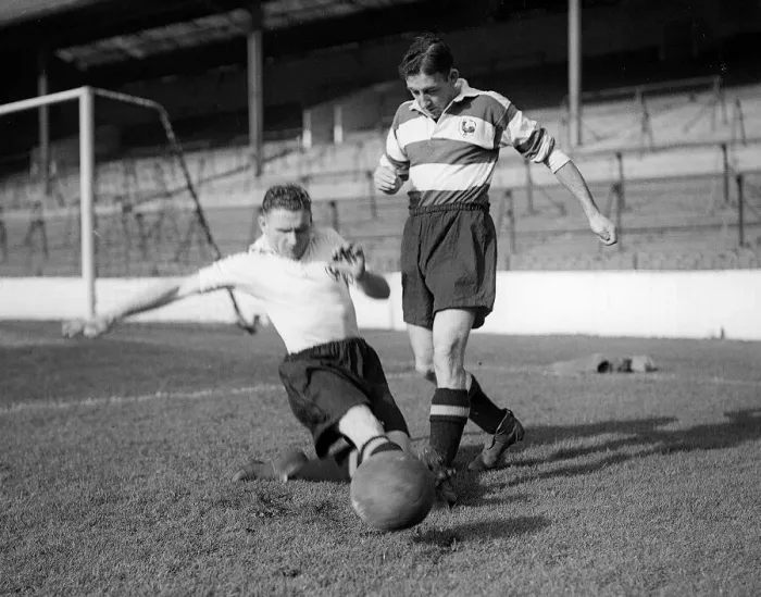 Framed Print : Bill Nicholson of Tottenham Hotspur performs a sliding tackle on teammate Freddie Cox Framed Print : Bill Nicholson of Tottenham Hotspur performs a sliding tackle on teammate Freddie Cox