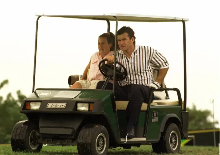 Framed Print : Nick Faldo gives his caddie Fanny a lift in a golf car in Jamaica Framed Print : Nick Faldo gives his caddie Fanny a lift in a golf car in Jamaica