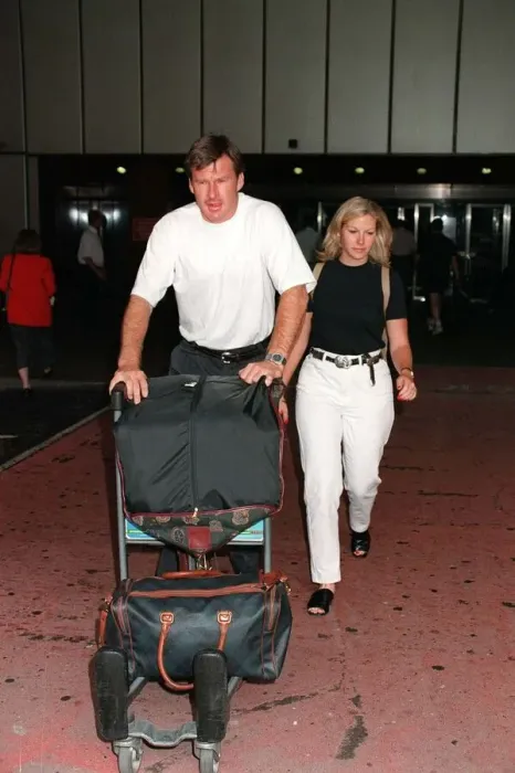 Framed Print : Nick Faldo Golf arrives at London Heathrow Airport from Montreal with girlfriend Brenna Framed Print : Nick Faldo Golf arrives at London Heathrow Airport from Montreal with girlfriend Brenna