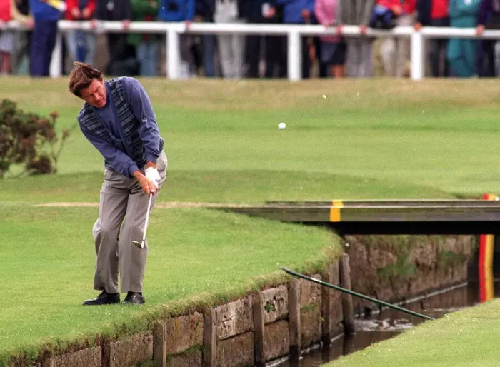 Framed Print : Nick Faldo plays over the Swilken burn at the 1st after putting his ball in the water in Framed Print : Nick Faldo plays over the Swilken burn at the 1st after putting his ball in the water in