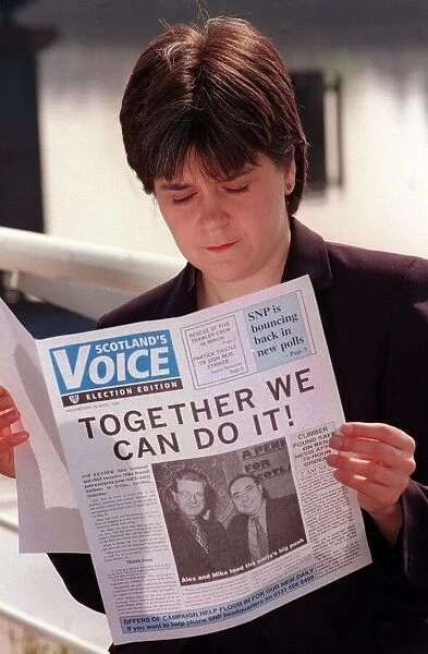 Nicola Sturgeon April 1999 reading a copy of Scotlands Voice newspaper