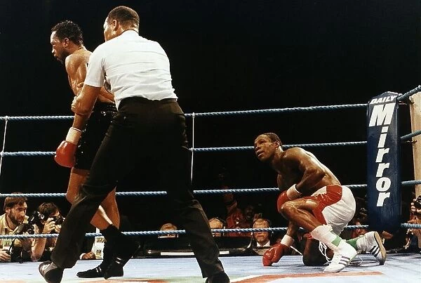 Nigel Benn Boxer Is Pulled Away By The Referee After Putting Chris Eubank On The Floor