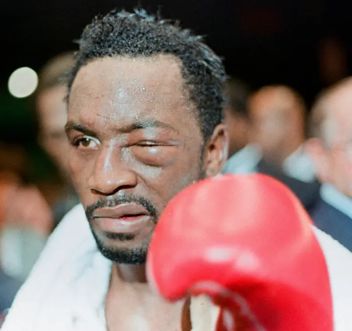 Framed Print : Nigel Benn leaves the ring at the NEC in Birmingham. 18th November 1990 after losing to Framed Print : Nigel Benn leaves the ring at the NEC in Birmingham. 18th November 1990 after losing to