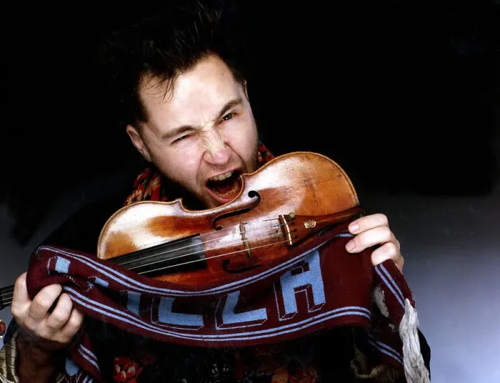 Framed Print : Nigel Kennedy Violinist Making to bite violin holding Aston Villa scarf
