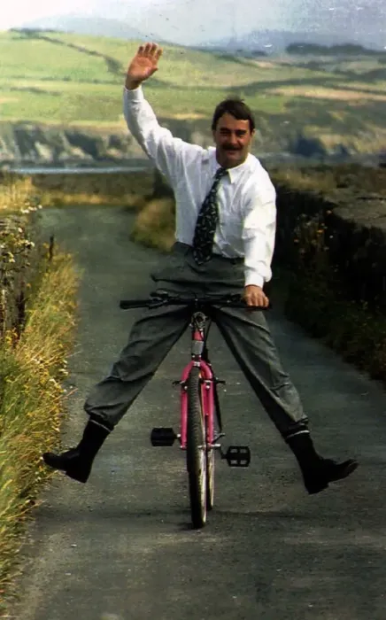 Framed Print : Nigel Mansell Formula One Racing Driver Riding A Bicycle Down A Country Lane Framed Print : Nigel Mansell Formula One Racing Driver Riding A Bicycle Down A Country Lane