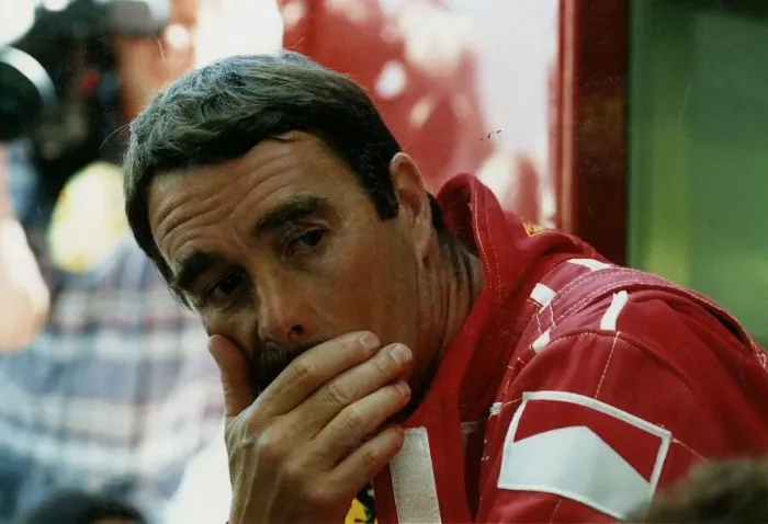Framed Print : Nigel Mansell Motor Racing Grand Prix Formula One Driver sits with resting his head in