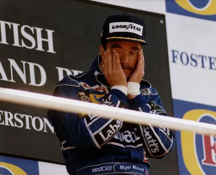 Framed Print : Nigel Mansell Motor Racing Grand Prix Formula One Driver standing on the winners podium