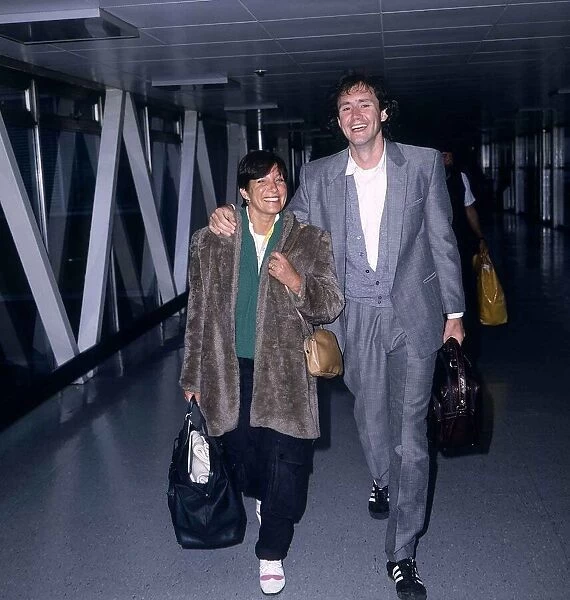 Nigel Planer Actor arriving at London Airport from Barbados with his wife Roberta Planer