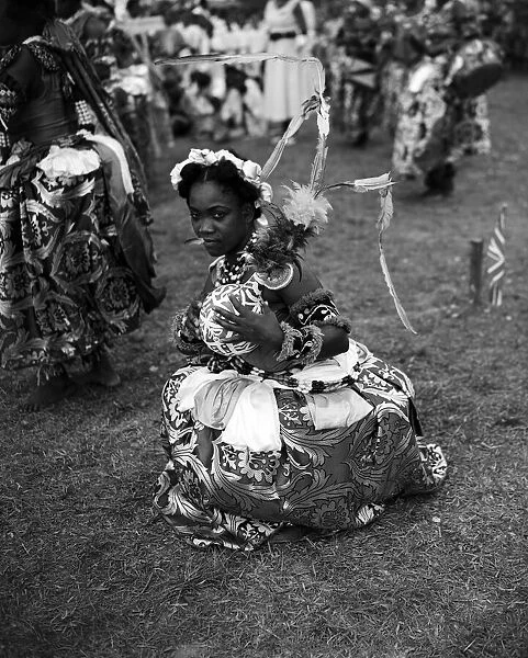 A Nigerian dancer from the Efik tribe stops at the end of a traditional dance for The