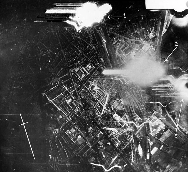 Night photograph taken from RAF bombers while making a heavy attack upon Munster