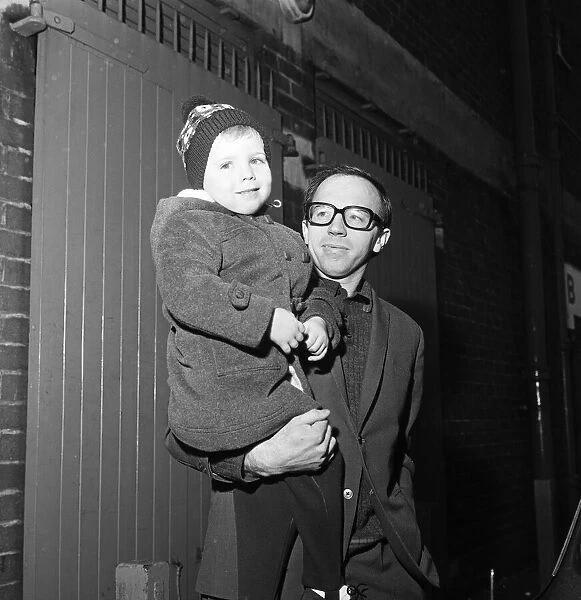 Nobby Stiles, the Manchester United half back leaves Old Trafford with his 3-year-old son