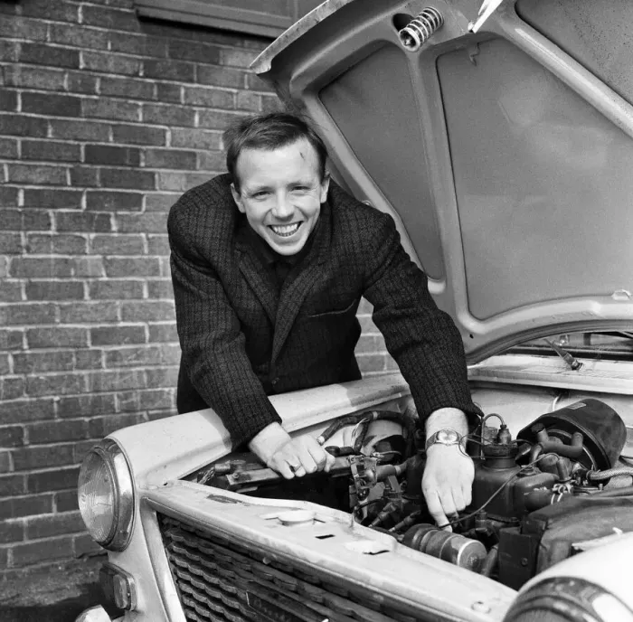 Framed Print : Nobby Stiles Manchester United player seen here tinkering with the engine of his car 8th