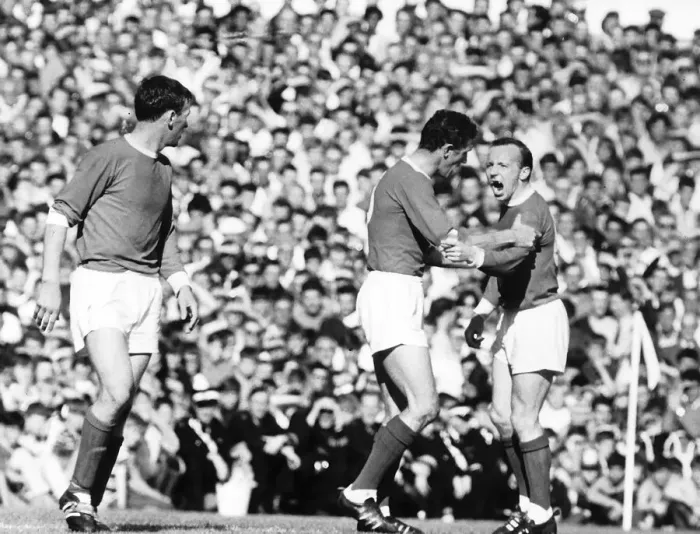 Framed Print : Nobby Stiles is restrained by teamate Bill Faulkes 1966 after an incident with Framed Print : Nobby Stiles is restrained by teamate Bill Faulkes 1966 after an incident with