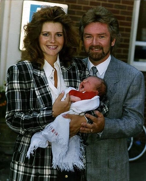 Noel Edmonds Tv Presenter with new born baby Olivia and wife Helen