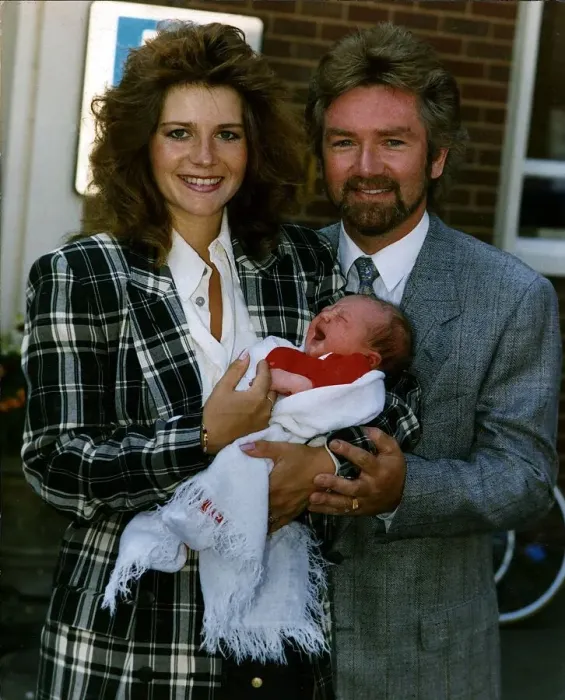 Framed Print : Noel Edmonds Tv Presenter with new born baby Olivia and wife Helen Framed Print : Noel Edmonds Tv Presenter with new born baby Olivia and wife Helen