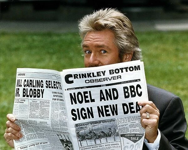 Noel Edmonds Tv Presenter reading newspaper called the Crinkley Bottom Observer after