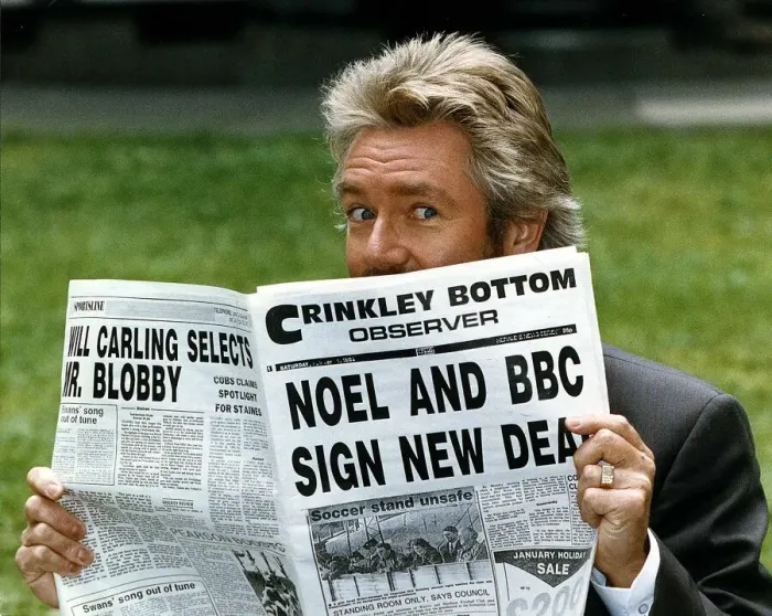 Framed Print : Noel Edmonds Tv Presenter reading newspaper called the Crinkley Bottom Observer after Framed Print : Noel Edmonds Tv Presenter reading newspaper called the Crinkley Bottom Observer after