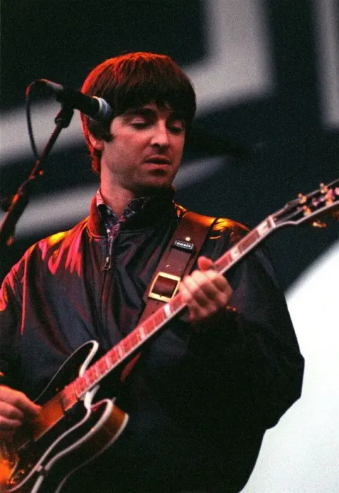 Framed Print : Noel Gallagher of Oasis playing guitar on stage during their concert at Balloch Country