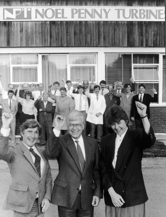 Framed Print : Noel Penny, owner and Chairman of Noel Penny Turbines celebrates as he signs a joint
