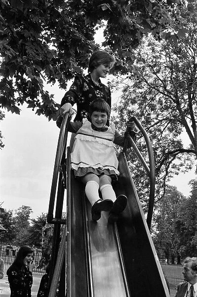 The Nolan sisters, Bernadette (13) and Coleen (9) in Hyde Park, London. 18th August 1974