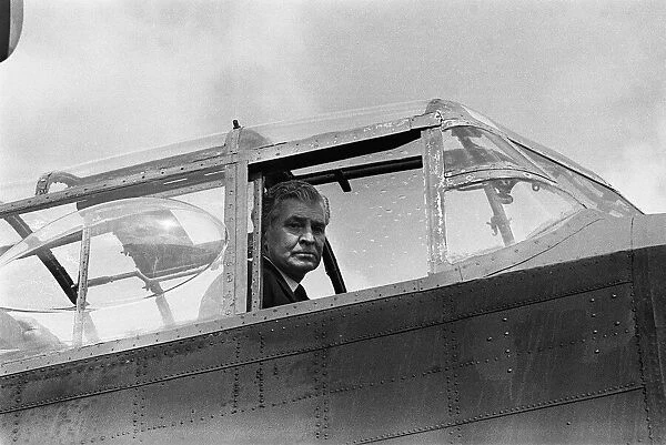 Norman Jackson VC sitting in the cockpit of an Avro Lancaster Bomber of the RAF Battle of