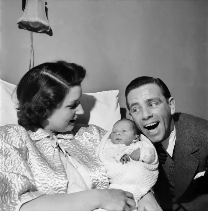 Framed Print : Norman Wisdom with baby son Nicholas. March 1953 D1491 Framed Print : Norman Wisdom with baby son Nicholas. March 1953 D1491