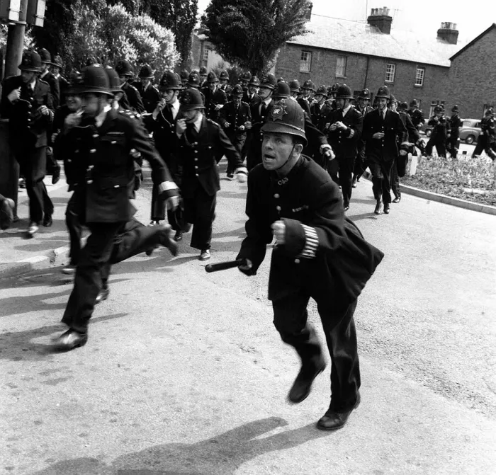 Framed Print : Norman Wisdom Comedian Actor in line with 120 policemen for the british comedy film Framed Print : Norman Wisdom Comedian Actor in line with 120 policemen for the british comedy film