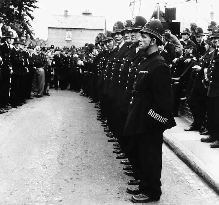 Framed Print : Norman Wisdom Comedian Actor in line with 120 policemen for the film Framed Print : Norman Wisdom Comedian Actor in line with 120 policemen for the film