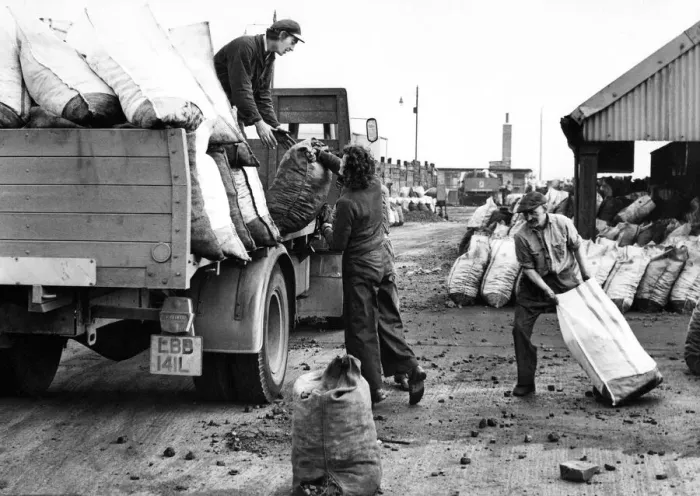 Framed Print : North East coal company men load up a wagon with coal and coke in their yard next to
