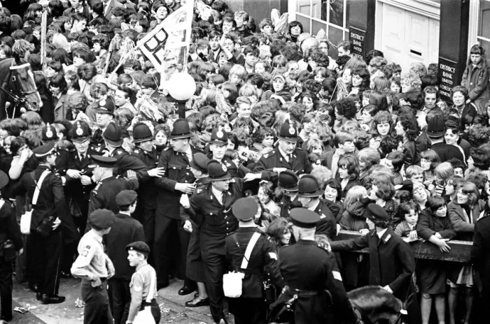 Framed Print : Northern Premier of A Hard Days Night'. Fans line up along the streets in Framed Print : Northern Premier of A Hard Days Night'. Fans line up along the streets in