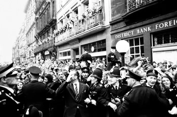 Framed Print : Northern Premier of A Hard Days Night'. Fans line up along the streets in Framed Print : Northern Premier of A Hard Days Night'. Fans line up along the streets in