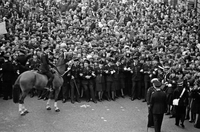 Framed Print : Northern Premier of A Hard Days Night'. Fans line up along the streets in Framed Print : Northern Premier of A Hard Days Night'. Fans line up along the streets in