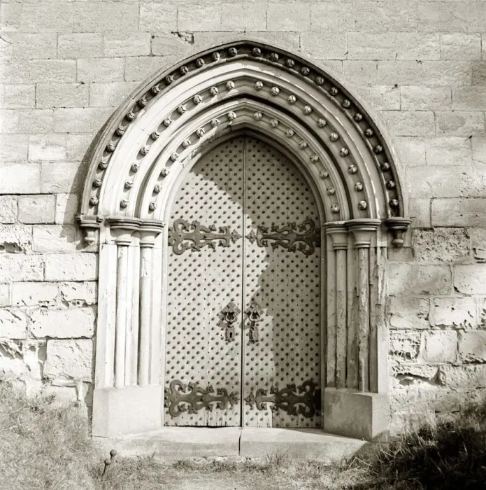 Framed Print : Norton Church Studded siege doors Norman Door Wall of building with Framed Print : Norton Church Studded siege doors Norman Door Wall of building with