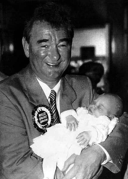 Nottingham Forest manager Brian Clough holding a baby May 1991