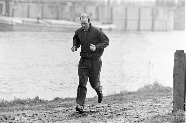 Nottingham Forest team training session. Terry Hennessey training beside the River