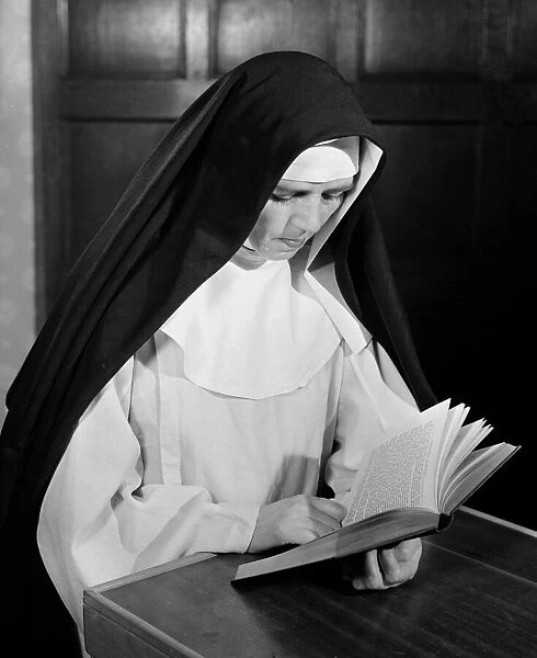 A nun reading her book Circa 1954