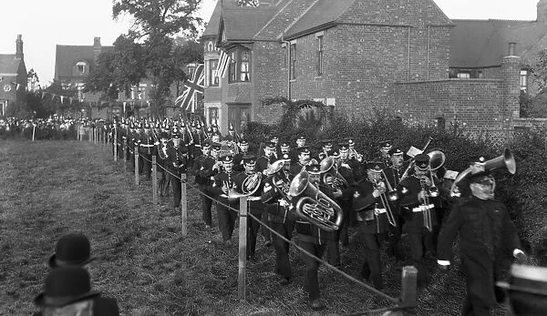 Nuneaton volunteers march off behind the battalion band of the Royal Warwickshire