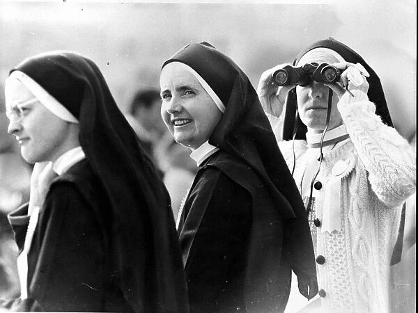 Nuns - Nuns. one with binoculars, wait to see the Pope John Paul at Pontcanna fields