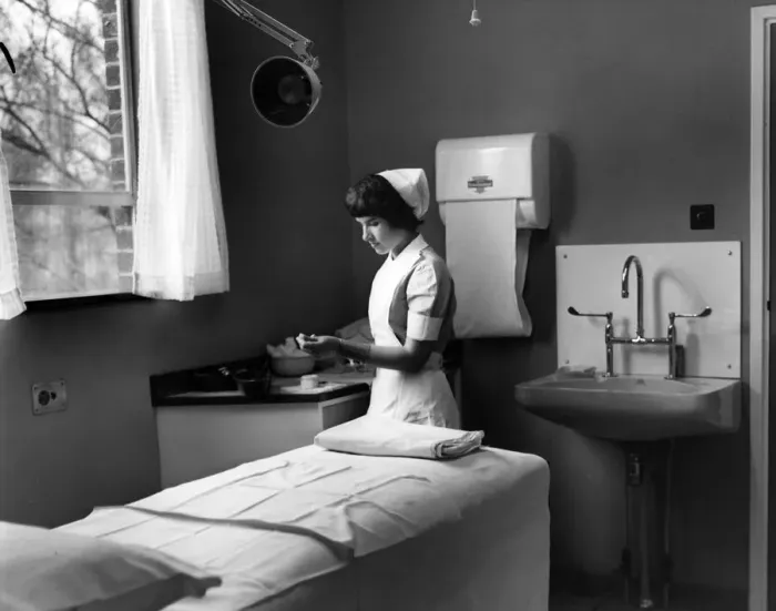Framed Print : Nurse Phoebe Barrett, aged 22, in one of the consultant examination rooms at Birmingham Framed Print : Nurse Phoebe Barrett, aged 22, in one of the consultant examination rooms at Birmingham