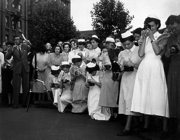 Nurses of the London Hospital in Whitechapel wait to take a picture of Her Majesty Queen
