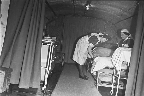 Nurses prepare a bed at a First Aid Post in Dover dug into the white cliffs