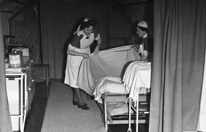Framed Print : Nurses prepare a bed at a First Aid Post in Dover dug into the white cliffs Framed Print : Nurses prepare a bed at a First Aid Post in Dover dug into the white cliffs