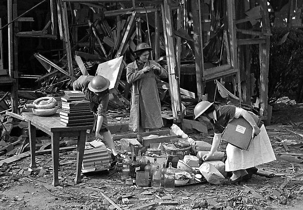 Nurses take a record of the remains in the midst of the bomb damage at London Hospital