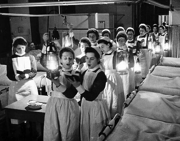 Nurses sing carols on Christmas Eve to patients in hospital in the wards 1940 World War