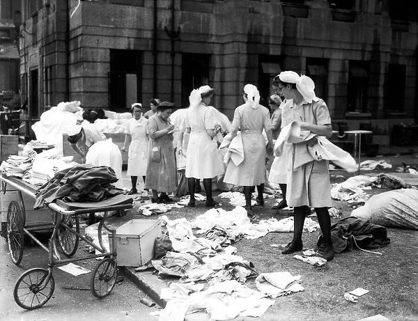 Nurses sorting linen outside Lewisham hospital after raid on the hospital the night