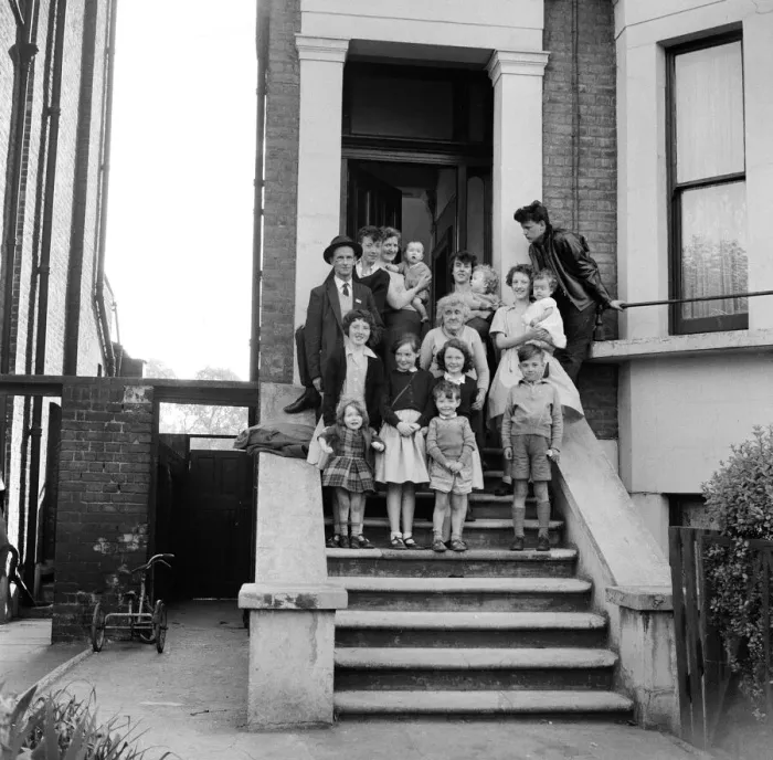 Framed Print : The O Brien family standing on the front steps outside their flat in New Cross Framed Print : The O Brien family standing on the front steps outside their flat in New Cross