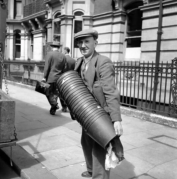 Occupations: Removals: Removal man at the offices of National Insurance seen here holding
