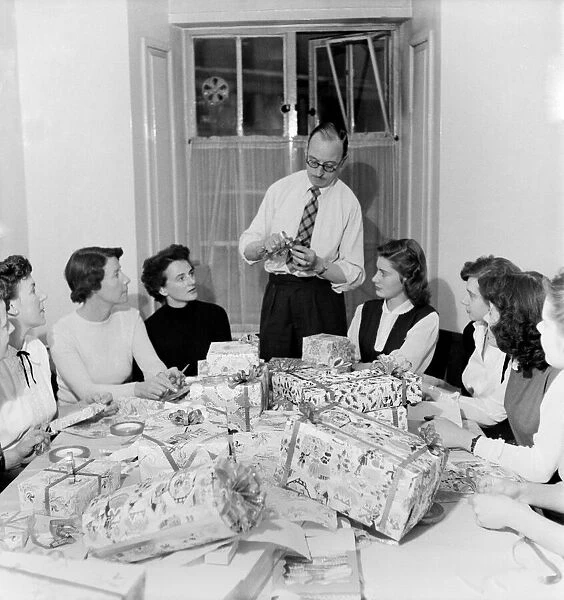 Occupations: Shop Assistants. Shop assistants seen here learning how to wrap Christmas