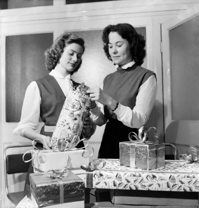 Framed Print : Occupations: Shop Assistants. Shop assistants seen here learning how to wrap Christmas