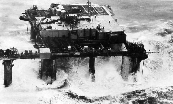 Ocean Prince North sea oil rig breaking up in rough sea. March 1968 P004428